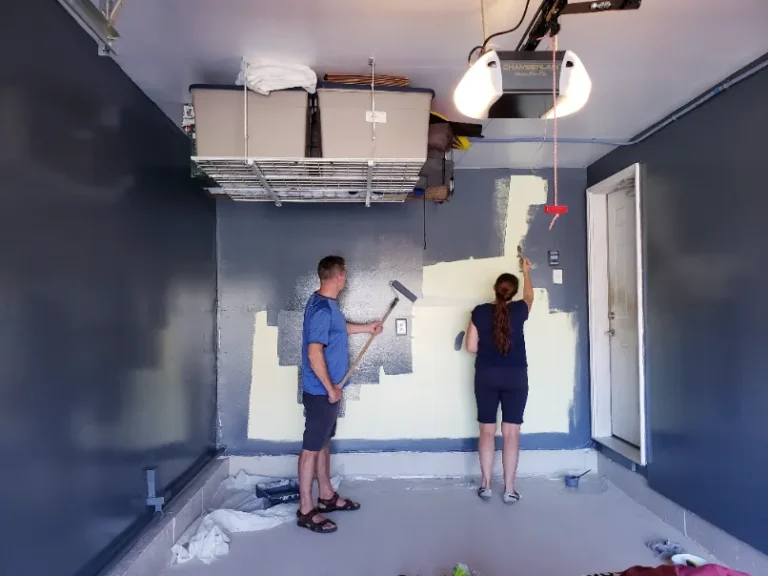 Two painter in the bedroom painting the interior.